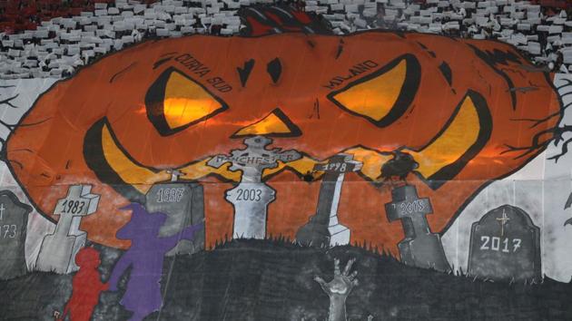 AC Milan supporters unveil a Halloween banner in support of their team prior to the start of the Serie A soccer match between AC Milan and Juventus, at the Milan San Siro stadium, Italy. (Antonio Calanni / AP)