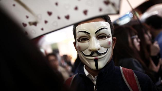 A man wearing an Anonymous mask takes part in a Halloween parade in Tokyo. (Behrouz Mehri / AFP)