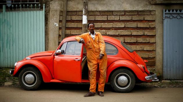 Ishetu Kinfe, 59, a mechanic, poses next to his 1965 Volkswagen Beetle at a garage in Addis Ababa, Ethiopia. Having driven the car for 19 years, he said, ‘I can drive it anywhere because it is strong, easy to maintain and affordable’. At garages in Addis Ababa, cranky, 50-year-old Beetles enjoy a kind of life after death --their parts are never discarded but re-used to keep the city’s remaining Beetles on the road. (Tiksa Negeri / REUTERS) Ishetu Kinfe, 59, a mechanic, poses next to his 1965 Volkswagen Beetle at a garage in Addis Ababa, Ethiopia. Having driven the car for 19 years, he said, ‘I can drive it anywhere because it is strong, easy to maintain and affordable’. At garages in Addis Ababa, cranky, 50-year-old Beetles enjoy a kind of life after death --their parts are never discarded but re-used to keep the city’s remaining Beetles on the road. (Tiksa Negeri / REUTERS)