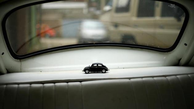 A miniature VW Beetle toy is seen inside a Beetle car at a garage in Addis Ababa. The Beetle was born in the 1930s out of Adolf Hitler’s desire to produce a cheap ‘people’s car’ for the German family. Post World War Two it sold in the tens of millions around the globe and in the 1960s even starred in a Disney movie as Herbie the ‘Love Bug’. (Tiksa Negeri / REUTERS) A miniature VW Beetle toy is seen inside a Beetle car at a garage in Addis Ababa. The Beetle was born in the 1930s out of Adolf Hitler’s desire to produce a cheap ‘people’s car’ for the German family. Post World War Two it sold in the tens of millions around the globe and in the 1960s even starred in a Disney movie as Herbie the ‘Love Bug’. (Tiksa Negeri / REUTERS)