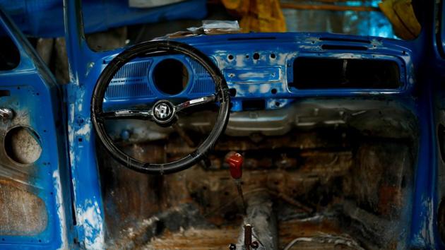 The interior of a stripped down Beetle car is seen at a garage in Addis Ababa. Kinfe considers the car an affordable and extremely reliable machine. ‘They never fail you - they take you anywhere and have excellent functionality,’ he said. ‘I wish the Germans had continued producing them. They abandoned them and things started falling apart.’ (Tiksa Negeri / REUTERS) The interior of a stripped down Beetle car is seen at a garage in Addis Ababa. Kinfe considers the car an affordable and extremely reliable machine. ‘They never fail you - they take you anywhere and have excellent functionality,’ he said. ‘I wish the Germans had continued producing them. They abandoned them and things started falling apart.’ (Tiksa Negeri / REUTERS)