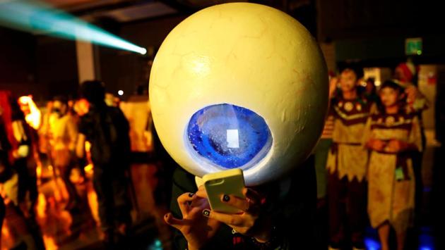 A participant in costume uses a mobile phone at a Halloween event in Kawasaki, Japan. (Kim Kyung-Hoon / REUTERS)