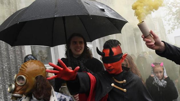 Revellers in costumes take part in a 'Zombies March' in central Kiev, Ukraine ahead of Halloween celebrations. (Sergei Supinsky / AFP)