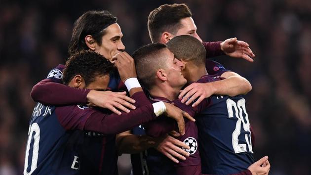 Paris Saint-Germain players celebrate after qualifying for the UEFA Champions League knockouts. They thrashed Anderlecht 5-0 at the Parc des Princes Stadium in Paris on Tuesday. (AFP)