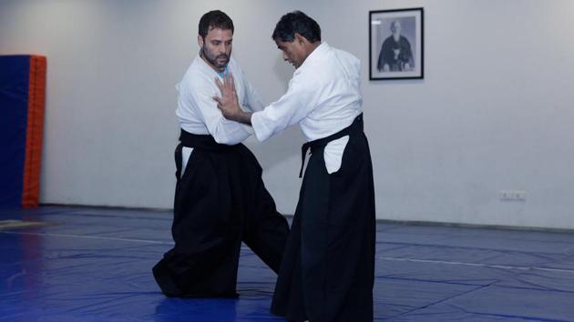 The Congress re-tweeted a Twitter post on Tuesday showing Rahul Gandhi performing aikido with his instructor, days after the 47-year-old leader said he plays sports for about an hour.(Twitter/@bharad)
