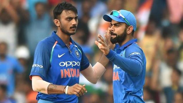 Axar Patel (L) finished with figures of 2/20 in India’s 53-run win over New Zealand in the 1st T20I at the Feroz Shah Kotla on Wednesday.(AFP) Axar Patel (L) finished with figures of 2/20 in India’s 53-run win over New Zealand in the 1st T20I at the Feroz Shah Kotla on Wednesday.(AFP)