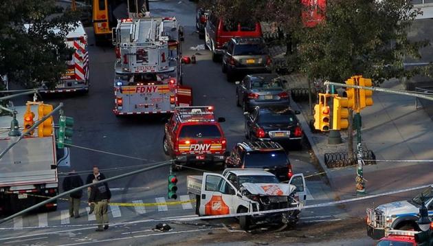 Emergency crews attend the scene of an alleged terror incident on West Street in Manhattan, New York on October 31 2017. A man in a rented pickup truck mowed down pedestrians and cyclists along a busy bike path near the World Trade Center memorial on Tuesday, killing at least eight and seriously injuring 11 in what the mayor Bill de Blasio called ‘a particularly cowardly act of terror.’ (Andrew Kelly / REUTERS) Emergency crews attend the scene of an alleged terror incident on West Street in Manhattan, New York on October 31 2017. A man in a rented pickup truck mowed down pedestrians and cyclists along a busy bike path near the World Trade Center memorial on Tuesday, killing at least eight and seriously injuring 11 in what the mayor Bill de Blasio called ‘a particularly cowardly act of terror.’ (Andrew Kelly / REUTERS)