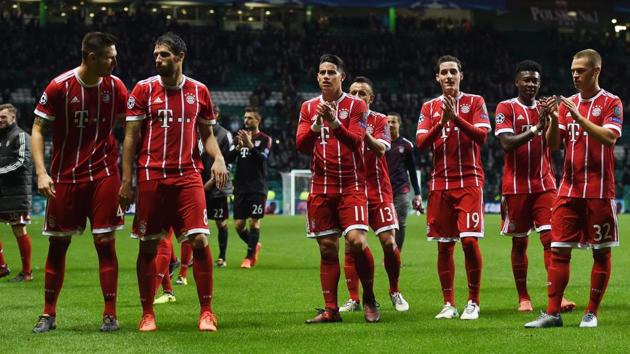 Bayern Munich players applaud fans after also qualifying for the UEFA Champions League Group knockouts after their 2-1 win over Celtic in Glasgow. (AFP)