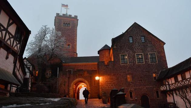 A view of the Wartburg Castle in Eisenach in eastern Germany, which is known as the place where German church reformer Martin Luther translated the New Testament of the Bible into German. (Jens Kalaene / dpa / AFP) 