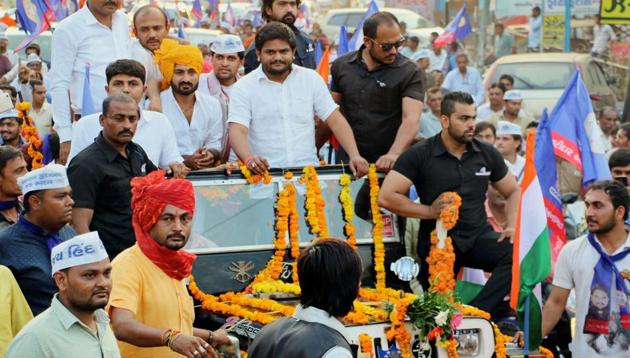 PAAS convener Hardik Patel during a road show in Bhavnagar/ (PTI File) PAAS convener Hardik Patel during a road show in Bhavnagar/ (PTI File)