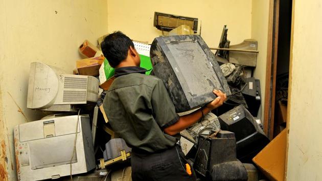 A person disposes of e-waste at a scrap dealer’s place in Noida.(Sunil Ghosh/HT File Photo) A person disposes of e-waste at a scrap dealer’s place in Noida.(Sunil Ghosh/HT File Photo)