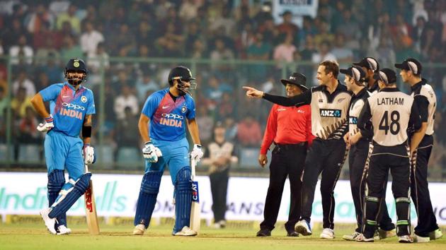 New Delhi: India's Rohit Sharma and Virat Kohli having a words with New Zealand players ,waits for reply of dismissal of Rohit Sharma during the first T20 match at Feroz Shah Kotla Stadium in New Delhi, on Wednesday. PTI Photo by Manvender Vashist (PTI11_1_2017_000208a)(PTI) New Delhi: India's Rohit Sharma and Virat Kohli having a words with New Zealand players ,waits for reply of dismissal of Rohit Sharma during the first T20 match at Feroz Shah Kotla Stadium in New Delhi, on Wednesday. PTI Photo by Manvender Vashist (PTI11_1_2017_000208a)(PTI)