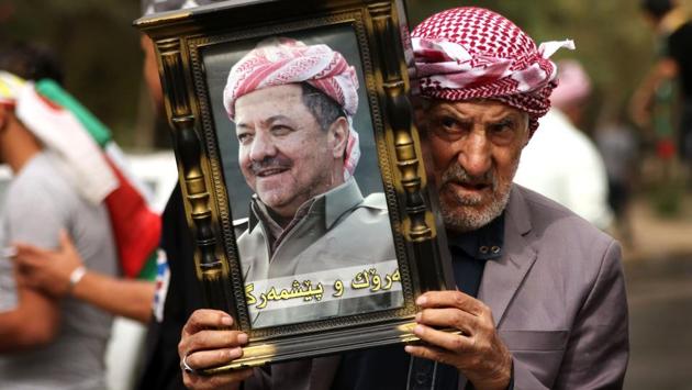An Iraqi Kurd holds a picture of Kurdish Regional Government (KRG) leader Massud Barzani, during a protest in his support in Arbil, the capital of autonomous Iraqi Kurdistan. Masoud Barzani told a closed-door session of the regional parliament on October 29, 2017 that he was stepping down amid the fallout of the controversial Kurdish independence referendum and Iraqi military intervention in Kurdish-held territories. (Safin Hamed / AFP) An Iraqi Kurd holds a picture of Kurdish Regional Government (KRG) leader Massud Barzani, during a protest in his support in Arbil, the capital of autonomous Iraqi Kurdistan. Masoud Barzani told a closed-door session of the regional parliament on October 29, 2017 that he was stepping down amid the fallout of the controversial Kurdish independence referendum and Iraqi military intervention in Kurdish-held territories. (Safin Hamed / AFP)