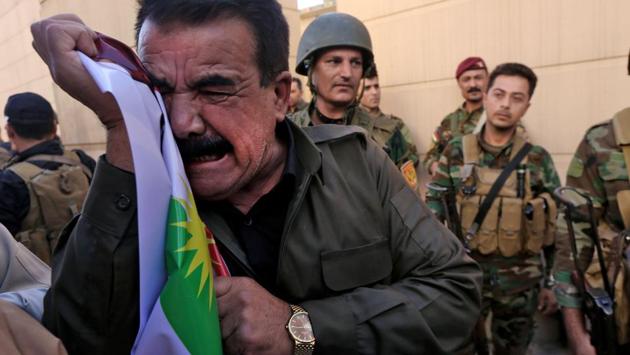 Iraqi Kurds take part in a demonstration outside the US consulate in Erbil to protest against the escalating crisis with Baghdad. Washington, which has worked closely with both Kurdish and Iraqi forces in the battle against the Islamic State group, had urged Barzani not to go ahead with the vote. (Safin Hamed / AFP) Iraqi Kurds take part in a demonstration outside the US consulate in Erbil to protest against the escalating crisis with Baghdad. Washington, which has worked closely with both Kurdish and Iraqi forces in the battle against the Islamic State group, had urged Barzani not to go ahead with the vote. (Safin Hamed / AFP)
