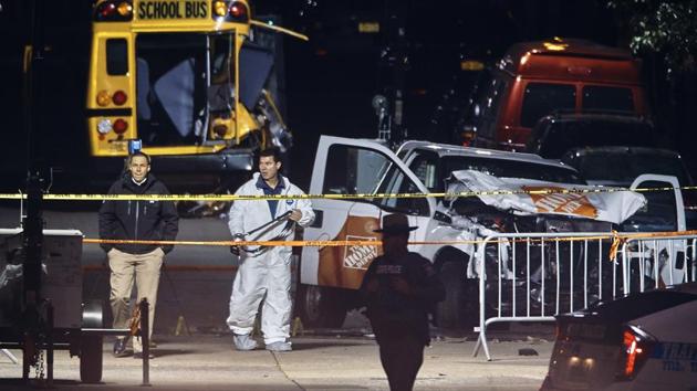 Police work near a damaged Home Depot truck after a motorist drove onto a bike path near the World Trade Center memorial, striking and killing several people on November 1, 2017.(AP)