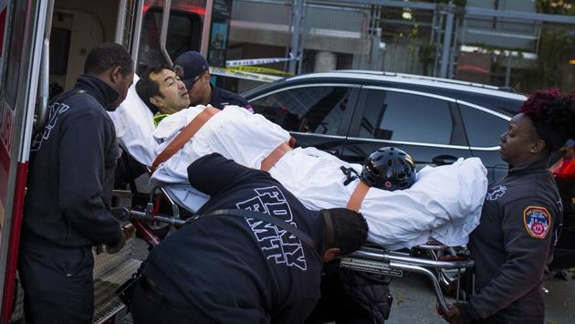 Emergency personnel carry a man into an ambulance after the attack near the World Trade Center memorial. New York Governor Andrew Cuomo called it a ‘lone wolf’ attack and said there was no evidence to suggest it was part of a wider plot. The city’s police commissioner, James O’Neill, said a statement the driver made as he got out of the truck and the method of attack led police to conclude it was a terrorist act. (Andres Kudacki / AP) Emergency personnel carry a man into an ambulance after the attack near the World Trade Center memorial. New York Governor Andrew Cuomo called it a ‘lone wolf’ attack and said there was no evidence to suggest it was part of a wider plot. The city’s police commissioner, James O’Neill, said a statement the driver made as he got out of the truck and the method of attack led police to conclude it was a terrorist act. (Andres Kudacki / AP)