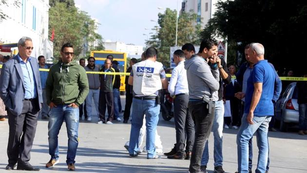 Police officers are seen where a suspected Islamist militant was arrested after wounding two policemen in a knife attack near the parliament building in Tunis. (REUTERS) Police officers are seen where a suspected Islamist militant was arrested after wounding two policemen in a knife attack near the parliament building in Tunis. (REUTERS)