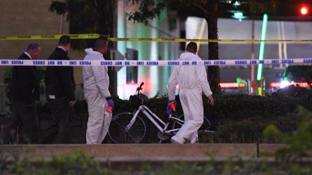 Authorities inspect the scene following a shooting incident in New York on Tuesday. (AFP Photo) Authorities inspect the scene following a shooting incident in New York on Tuesday. (AFP Photo)