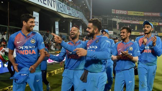 Virat Kohli and Shikhar Dhawan have fun with Ashish Nehra after the end of the game against New Zealand at the Kotla. (PTI) 