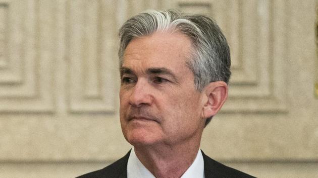 In this file photo, Jerome Powell talks with others before a board of governors meeting at the Marriner S. Eccles Federal Reserve Board Building in Washington. (AP) In this file photo, Jerome Powell talks with others before a board of governors meeting at the Marriner S. Eccles Federal Reserve Board Building in Washington. (AP)