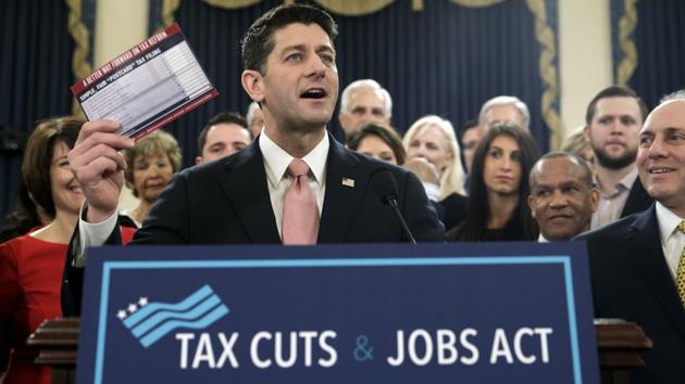 Speaker of the House Paul Ryan, R-Wis., with House Majority Whip Steve Scalise, R-La., far right, holds a proposed "postcard tax filing form" as they unveil the GOP's far-reaching tax overhaul, the first major revamp of the tax system in three decades, on Capitol Hill in Washington, Thursday, Nov. 2, 2017. (AP) Speaker of the House Paul Ryan, R-Wis., with House Majority Whip Steve Scalise, R-La., far right, holds a proposed "postcard tax filing form" as they unveil the GOP's far-reaching tax overhaul, the first major revamp of the tax system in three decades, on Capitol Hill in Washington, Thursday, Nov. 2, 2017. (AP)