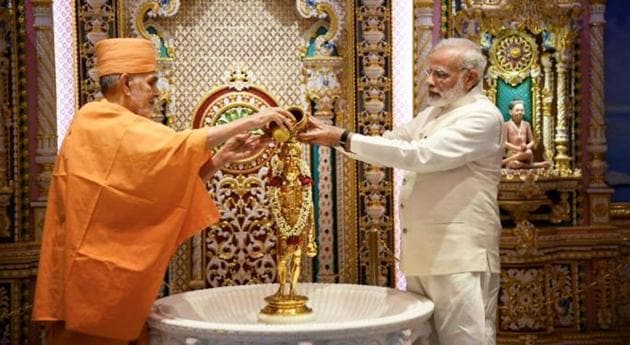 Prime Minister Narendra Modi along with Mahant Swami Maharaj offer puja at Akshardham on the occasion of the temple’s silver jubilee celebration in Gandhinagar on November 2. (PTI Photo) Prime Minister Narendra Modi along with Mahant Swami Maharaj offer puja at Akshardham on the occasion of the temple’s silver jubilee celebration in Gandhinagar on November 2. (PTI Photo)