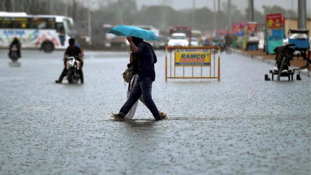 A couple crosses the water logged service road near the Marina beach during downpour in Chennai. Water logging in previous days has been reported in Anna Nagar, Vadapalani, West Mambalam, T Nagar, Ashok Nagar junction, Nandanam, Mogappair, Ambattur, Perambur, Mudichur, and Perangalathur. These areas faced severe problem in 2015 when Chennai was flooded for three days. (PTI) A couple crosses the water logged service road near the Marina beach during downpour in Chennai. Water logging in previous days has been reported in Anna Nagar, Vadapalani, West Mambalam, T Nagar, Ashok Nagar junction, Nandanam, Mogappair, Ambattur, Perambur, Mudichur, and Perangalathur. These areas faced severe problem in 2015 when Chennai was flooded for three days. (PTI)