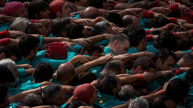 The group Colla els Castellers de Vilafranca formed a human tower called ‘Castell’ during the All Saints Day in Vilafranca del Penedes town in Spain. (Juan Medina / REUTERS) The group Colla els Castellers de Vilafranca formed a human tower called ‘Castell’ during the All Saints Day in Vilafranca del Penedes town in Spain. (Juan Medina / REUTERS)