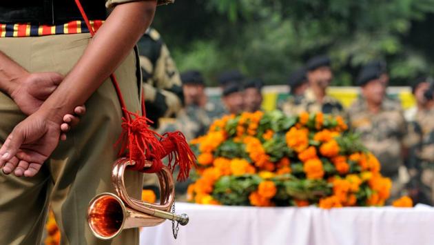 Border security force soldiers paying homage during a wreath-laying ceremony in Jammu on Friday. (HT Photo) Border security force soldiers paying homage during a wreath-laying ceremony in Jammu on Friday. (HT Photo)
