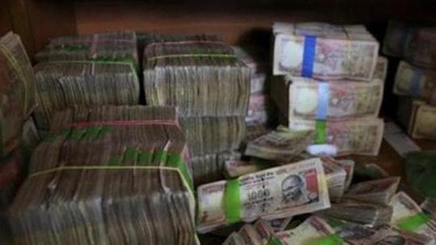 Demonetised currency notes of Rs 1,000 after they were deposited at a bank in Bangalore(AP) Demonetised currency notes of Rs 1,000 after they were deposited at a bank in Bangalore(AP)