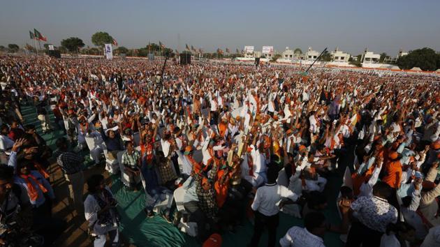 Supporters of Bharatiya Janata Party raise their hands during Gujarat pride convention in Gandhinagar on October 16.(AP Photo)