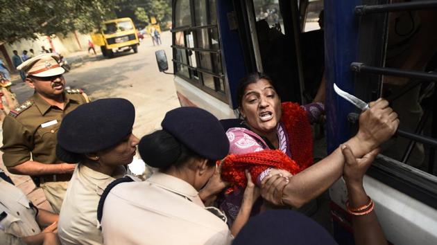 A protestor is detained after civic officials demolished tents and makeshift structures set up by protesters at Jantar Mantar, in New Delhi on October 30, 2017. The NGT on October 5 banned all protests and dharnas around Jantar Mantar on grounds of violation of environmental laws. (Burhaan Kinu / HT Photo)