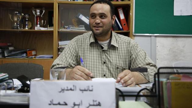 Palestinian Hitler Abu Hamad, deputy head at a school, sits at his office in the Israeli occupied city of Hebron, on September 26. (AFP Photo) Palestinian Hitler Abu Hamad, deputy head at a school, sits at his office in the Israeli occupied city of Hebron, on September 26. (AFP Photo)