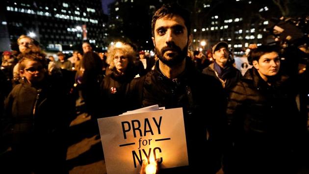 People gathered for a candlelight vigil for victims of the pickup truck attack at Foley Square in New York City on November 1, 2017. (Jeenah Moon / REUTERS) People gathered for a candlelight vigil for victims of the pickup truck attack at Foley Square in New York City on November 1, 2017. (Jeenah Moon / REUTERS)