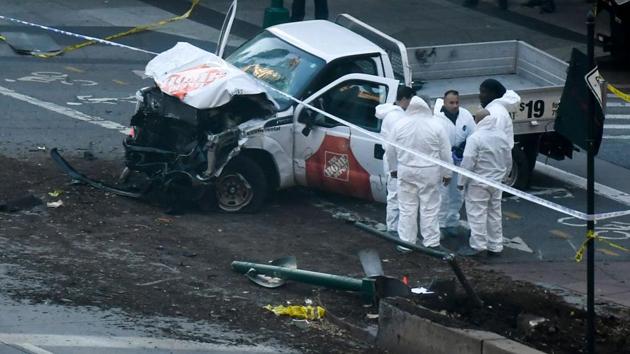 Investigators inspect a pickup truck which plowed into a pedestrian and bike path in Lower Manhattan killing eight people. The driver was shot in the abdomen by police after bailing out with what turned out to be paintball and pellet guns, shouting what witnesses said was ‘Allahu Akbar’. (Don Emmert / AFP) Investigators inspect a pickup truck which plowed into a pedestrian and bike path in Lower Manhattan killing eight people. The driver was shot in the abdomen by police after bailing out with what turned out to be paintball and pellet guns, shouting what witnesses said was ‘Allahu Akbar’. (Don Emmert / AFP)