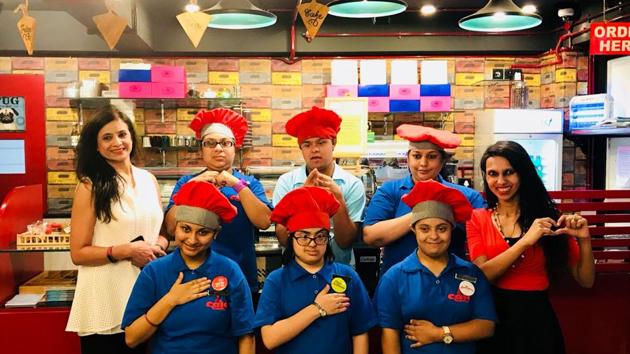 Minu Budhia (extreme left, in white) and Preeyam Budhia (in red) with some of those who would serve you at the cafe. (HT Photo) Minu Budhia (extreme left, in white) and Preeyam Budhia (in red) with some of those who would serve you at the cafe. (HT Photo)