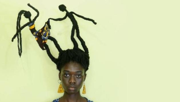 Laetitia Ky sculpted her hair into the image of a man lifting a woman’s skirt.(Instagram/Laetitia Ky)
