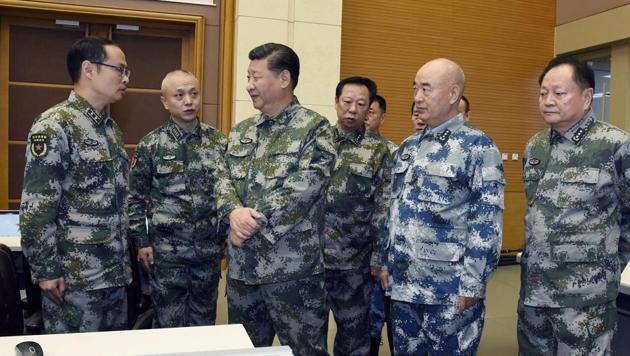 In this November 3, 2017 photo released by China's Xinhua news agency, President Xi Jinping (centre) visits the Central Military Commission (joint battle command centre in Beijing as part of an inspection tour.(AP)