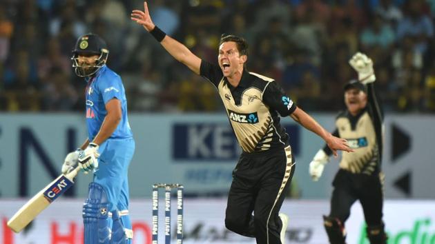 Trent Boult (C) appeals successfully against Rohit Sharma during the second India vs New Zealand T20 international in Rajkot.(AFP)