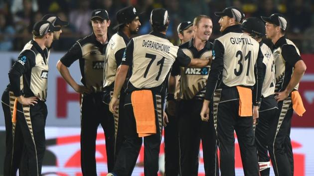 New Zealand players celebrate after dismissal of an Indian batsman in the second T20 in Rajkot . Catch full cricket score of India vs New Zealand, second Twenty20 International here.(AFP)