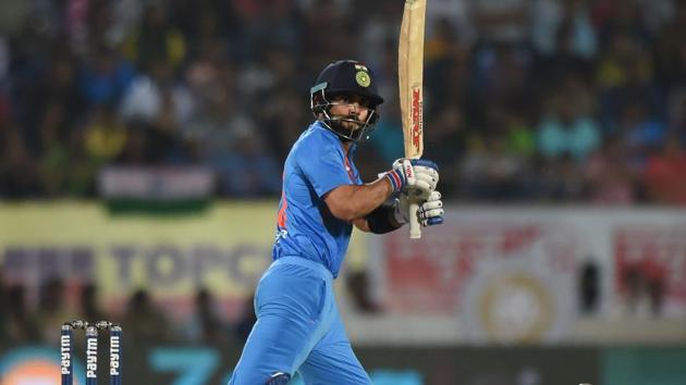 Virat Kohli plays a shot during the second India vs New Zealand T20 international in Rajkot.(AFP)