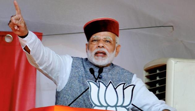 Prime Minister Narendra Modi waves at crowd during BJP Parivartan Rally at Rait near Dharamsala on Saturday. (PTI Photo) Prime Minister Narendra Modi waves at crowd during BJP Parivartan Rally at Rait near Dharamsala on Saturday. (PTI Photo)
