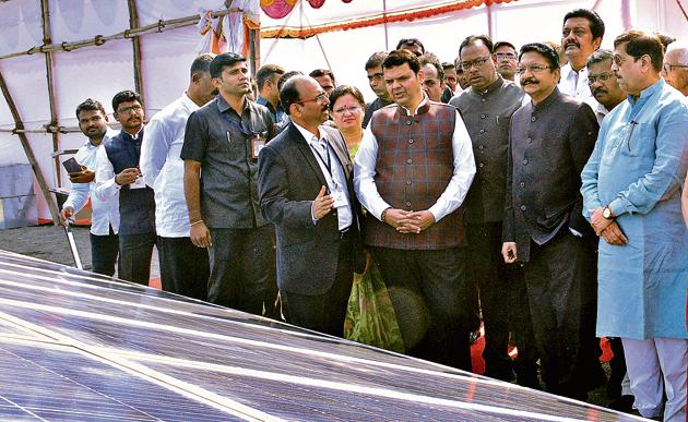 Chief minister Devendra Fadnavis (fourth from right), and governor Ch Vidyasagar Rao (second from right) at the inauguration of the solar power project at Raj Bhavan in the city on Sunday.(HT Photo)