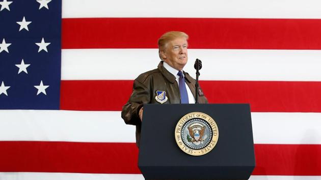 US President Donald Trump waits for first lady Melania Trump to depart as he begins remarks to members of the US military at Yokota Air Base, Japan on November 5. (REUTERS) US President Donald Trump waits for first lady Melania Trump to depart as he begins remarks to members of the US military at Yokota Air Base, Japan on November 5. (REUTERS)