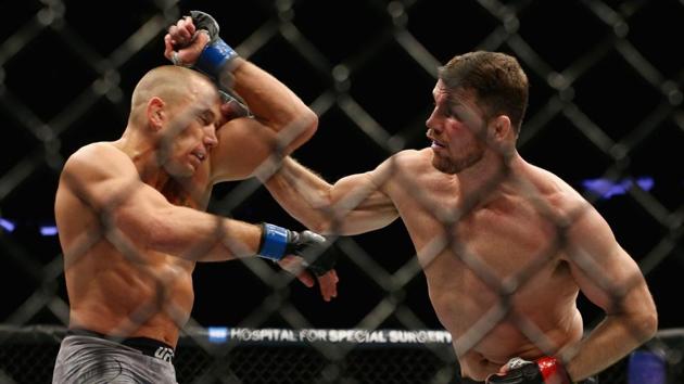 Michael Bisping and George St-Pierre face off at UFC 217 weigh-ins as the trash  talk continues