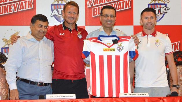 ATK coach Teddy Sheringham (second from left) and skipper Robbie Keane (right) unveil the team shirt with owners Utsav Parekh (left) and Sanjiv Goenka in Kolkata on Monday. (Photo courtesy: ATK) ATK coach Teddy Sheringham (second from left) and skipper Robbie Keane (right) unveil the team shirt with owners Utsav Parekh (left) and Sanjiv Goenka in Kolkata on Monday. (Photo courtesy: ATK)