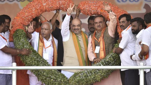 BJP national president Amit Shah (centre) with the party’s state unit president and chief minister candidate Yeddurappa (left) and Union minister Ananth Kumar during the inauguration of party's Parivartan Yatra in Bengaluru, on November 2, 2017. (Arijit Sen/HT File Photo) BJP national president Amit Shah (centre) with the party’s state unit president and chief minister candidate Yeddurappa (left) and Union minister Ananth Kumar during the inauguration of party's Parivartan Yatra in Bengaluru, on November 2, 2017. (Arijit Sen/HT File Photo)