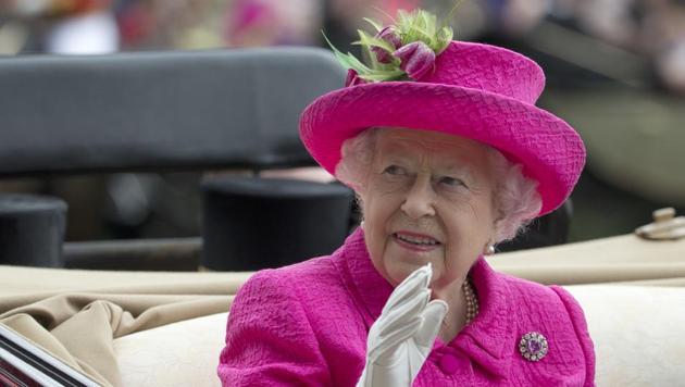 File photo showing Britain's Queen Elizabeth II waving to the crowd as she arrives by open carriage into the parade ring on the third day of the Royal Ascot horse race meeting on June 22, 2017. Newly leaked papers have revealed that Queen Elizabeth’s investment managers placed roughly £10 million ($13 million) in offshore portfolios in the Cayman Islands and Bermuda. (AP) File photo showing Britain's Queen Elizabeth II waving to the crowd as she arrives by open carriage into the parade ring on the third day of the Royal Ascot horse race meeting on June 22, 2017. Newly leaked papers have revealed that Queen Elizabeth’s investment managers placed roughly £10 million ($13 million) in offshore portfolios in the Cayman Islands and Bermuda. (AP)