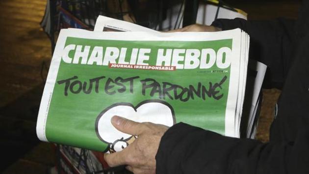 A seller of newspapers stocks several Charlie Hebdo newspapers at a newsstand in Nice, France on Jan. 14, 2015. (AP File Photo) A seller of newspapers stocks several Charlie Hebdo newspapers at a newsstand in Nice, France on Jan. 14, 2015. (AP File Photo)