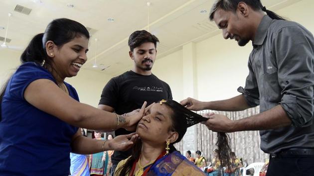 To make the day special for the couples participating in this unique ceremony, beauticians in the city pitched in with free make-up ahead of their wedding. (Ravindra Joshi / HT Photo) To make the day special for the couples participating in this unique ceremony, beauticians in the city pitched in with free make-up ahead of their wedding. (Ravindra Joshi / HT Photo)